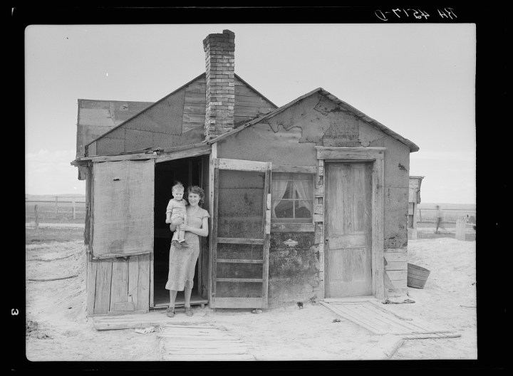 Two children of a poor farmer living in South Dakota in May 1936.