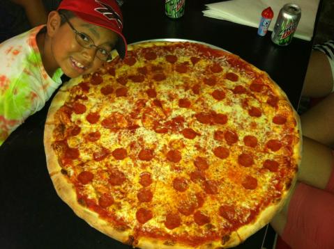 The Pizza At This Delicious South Carolina Eatery Is Bigger Than The Table