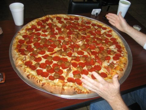 The Pizza At This Delicious Wisconsin Eatery Is Bigger Than The Table