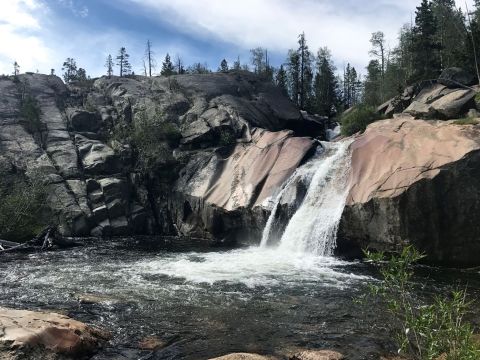 You’ll Want To Spend All Day At This Waterfall-Fed Pool In Wyoming