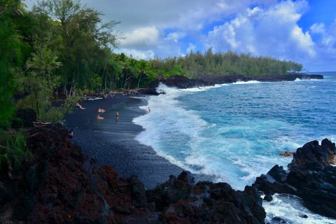 The Black Sand Beach In Hawaii That's A Known Dolphin Hangout