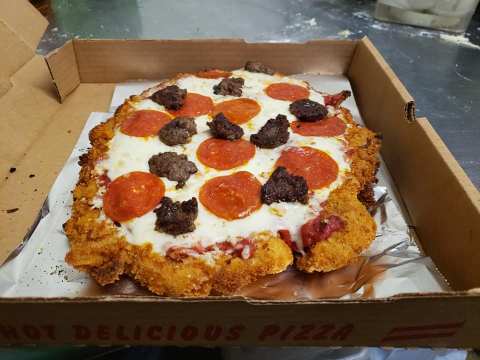 Get Your Favorite Pizza On Top Of A Breaded Tenderloin At Flo's, A Hometown Bar & Grill In Illinois