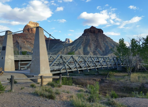 Walk Across A 160-Foot Suspension Bridge At San Rafael Bridge Campground In Utah