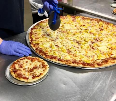 The Pizza Is As Big As The Table At Gusano's Pizzeria In Arkansas