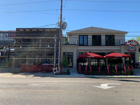 The Pizza At Fat Boy’s Pizza Near New Orleans Eatery Is Bigger Than The Table