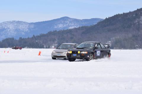 Toast Marshmallows On The Beach While Watching Ice Car Races At Lake George Winter Carnival In New York