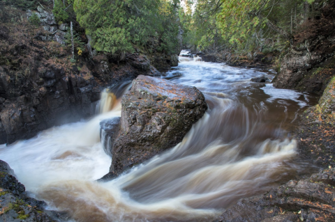 Watch A Waterfall Tumble Over A Rocky Gorge At The Breathtaking Cascade River State Park In Minnesota