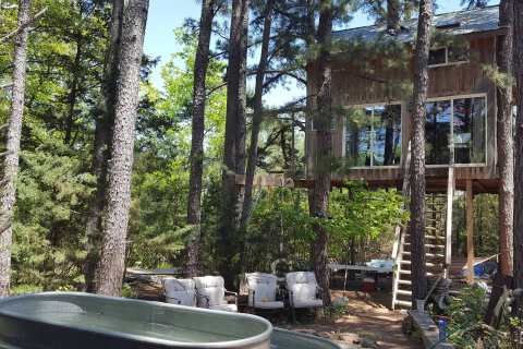 Sleep High Up In The Forest Canopy At The Enchanted Treehouse In Missouri