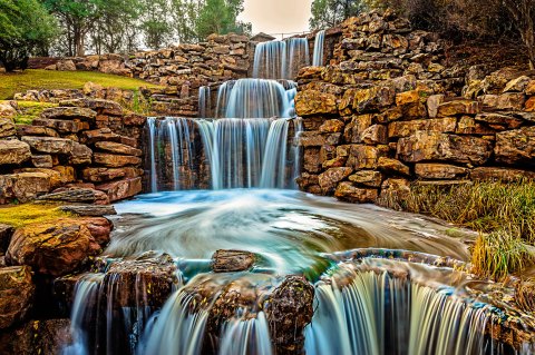 There's A Breathtaking Triple Waterfall Hiding In The Middle Of A Texas City Park