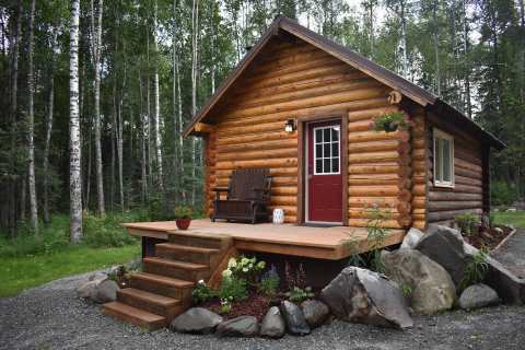 There's No Better Place To Hide Out Than This Cozy Alaskan Round Log Cabin In The Woods