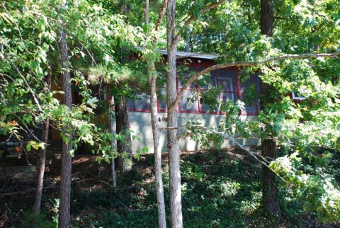 Stay On The Banks Of Alabama's Largest Lake At This Cozy Cabin Nestled In The Woods