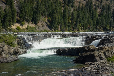 Plan A Visit To Kootenai Falls, Montana's Beautifully Blue Waterfall