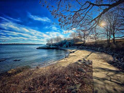 Disappear Into The Shores Of Half Moon Beach, A Small Crescent-Shaped Beach In Massachusetts