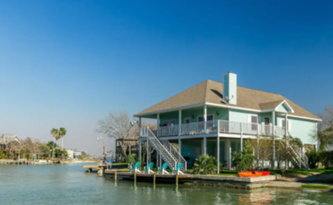 Forget The Resorts, Rent This Charming Waterfront Bungalow In Texas Instead