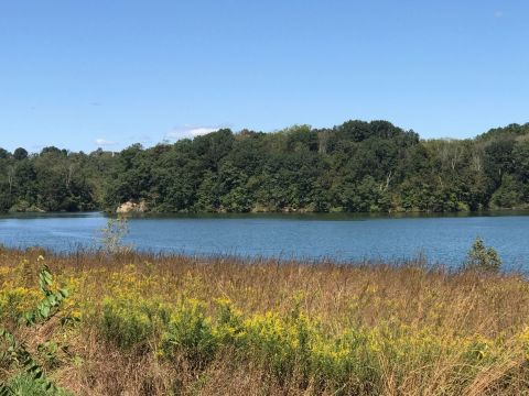 The Underrated Lake Border Trail In Pennsylvania Leads To A Turquoise Lake