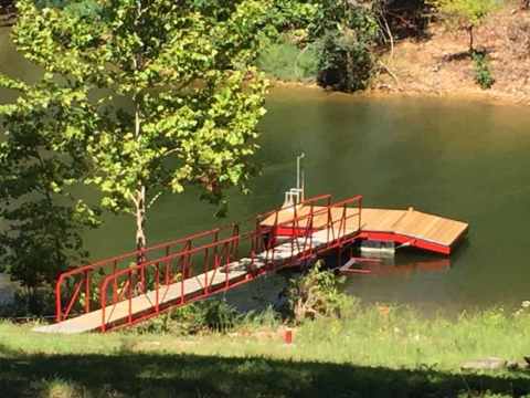 Stay In A Charming Oklahoma Cottage With Its Own Private Hot Tub and Lake View