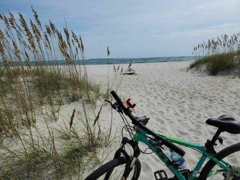 Walk Or Ride Alongside The Ocean On The 2.8-Mile Fort Macon Beach Trail In North Carolina