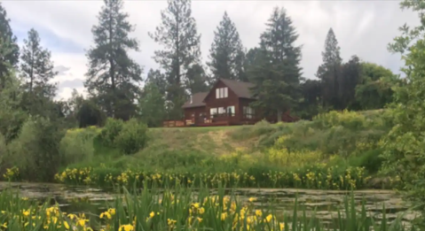 Soak In A Hot Tub Next To The Bitterroot River At This Cozy Montana Cabin