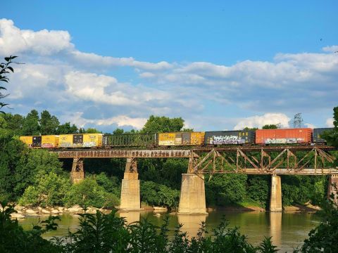 Watch Trains Roll Over The Trestle On A Casual Stroll Along The River In South Carolina