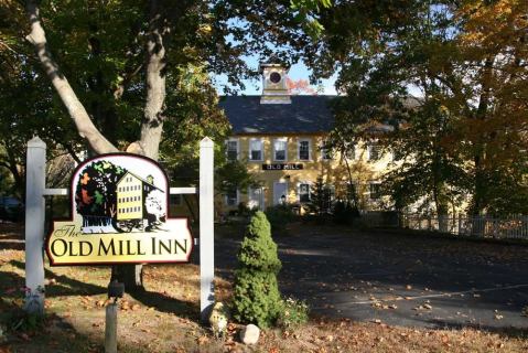 The Old Mill Inn Is A Historic Inn Overlooking A River And Waterfall In Massachusetts