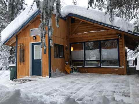 Spend The Night In A Cozy Cabin Hidden In The Middle Of The Alaskan Forest