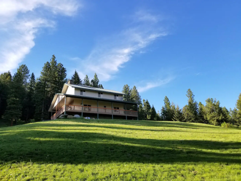 Escape Reality At This Impressive Off-The-Grid Cabin With Its Own Private Pond In Idaho