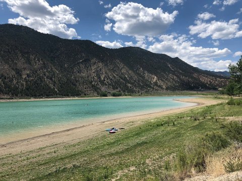 Enjoy Swimming With Stunning Views Of The Rocky Mountains At Colorado's Rifle Gap State Park