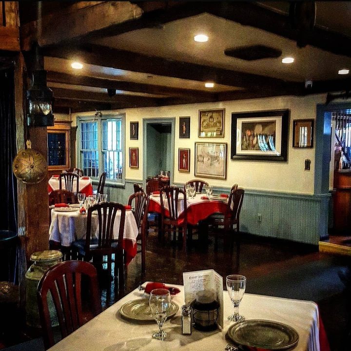 Dimly lit dining room of the Old '76 House in Tappan, rumored to be a haunted restaurant in New York