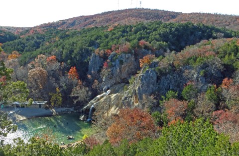 There's A Cave Right Next To A Waterfall In Oklahoma, Making For A Fun-Filled Family Outing