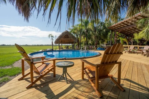 Soak In A Pool Surrounded By Natural Beauty At This Epic Rustic Cabin In Florida