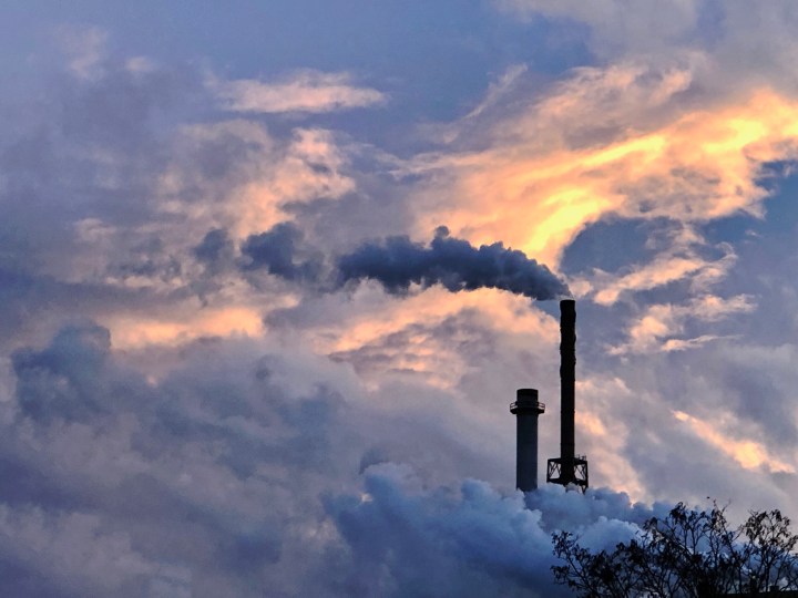 Smoke from mill during sunset