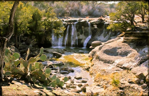 A Hidden Paradise In Texas, These Cabins Overlook A Private Waterfall