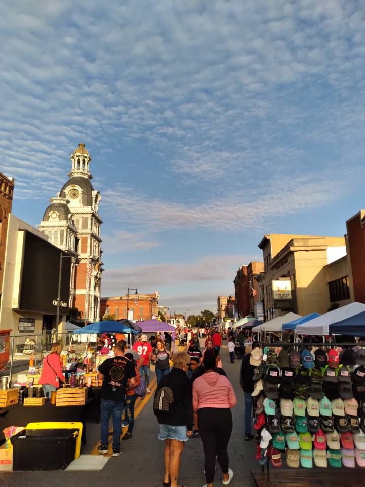 Sunset over a bustling street festival