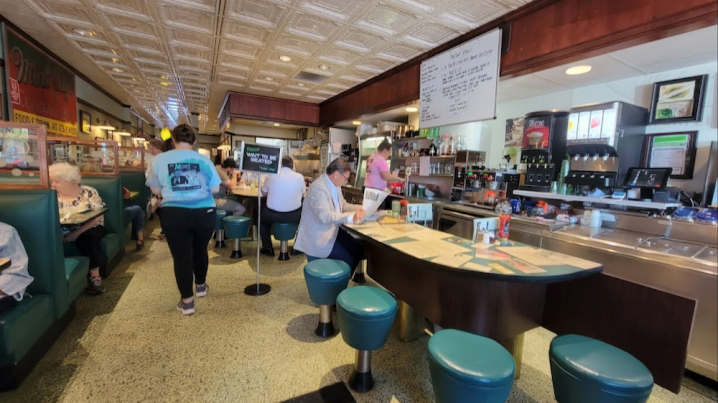 Interior of The Mint Café at a busy time with patrons. People come from all over to this hidden gem restaurant in Wausau, Wisconsin.