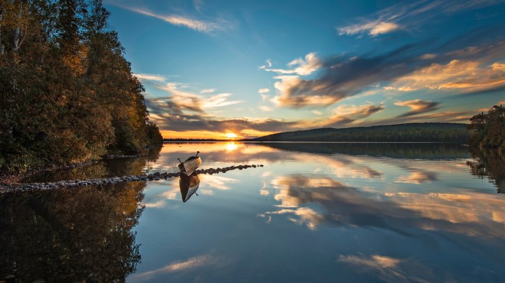 I went up to northern Minnesota last week to take pictures of the fall colors but they were a little behind normal this year - stopped at a small lake along the Gunflint Trail that leads into the Boundary Waters Canoe Area that borders MN with Canada - ran up on some rocks and took a picture of the reflection and sunset.