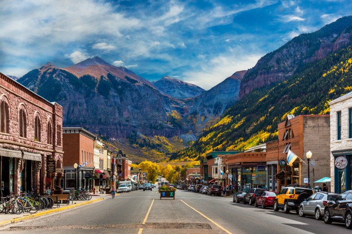 A look down Main Street in Telluride during Peak Autumn Color from the Aspens with a mountain backdrop