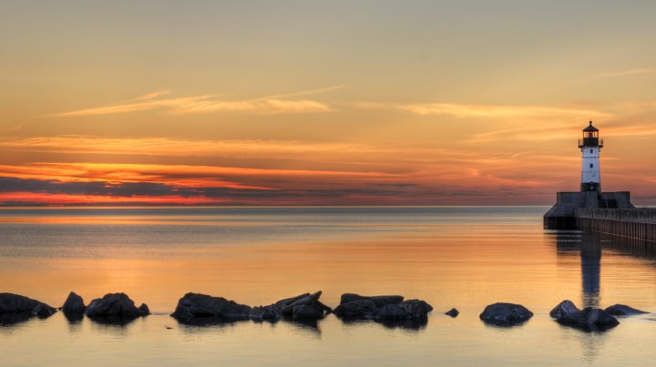 Great Lake Lighthouse Sunrise with Rocks - Duluth, Minnesota