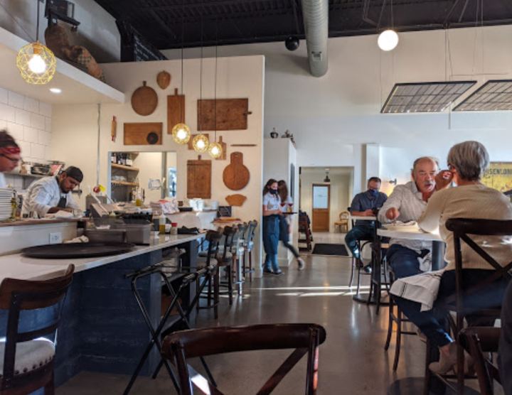 Interior of diners eating at tables in Mulino Italian Bistro in Lander, Wyoming