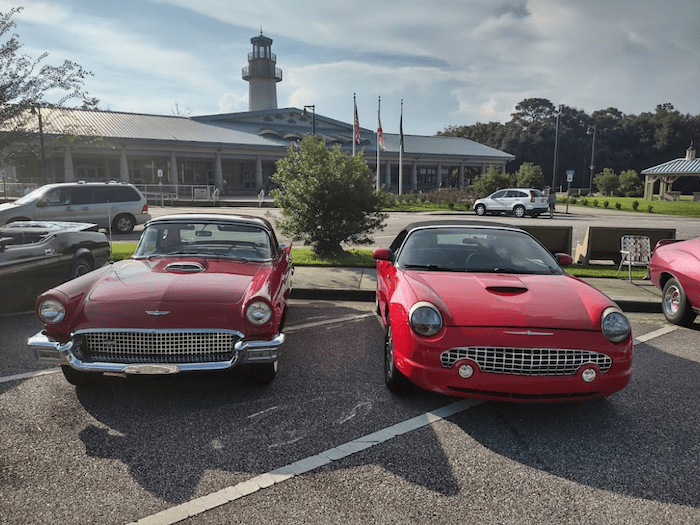 A car show in the parking lot of the Grand Bay Welcome Center, the best rest stop in Alabama.