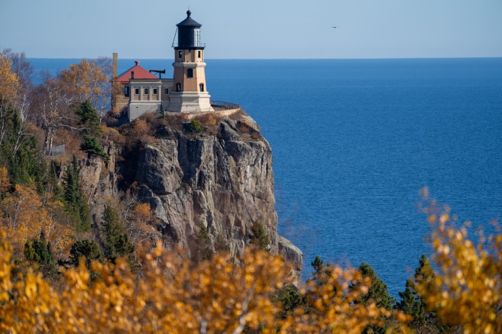 Natural framing of Split Rock Lighthouse on the North Shore of Minnesota, framed by fall leaves